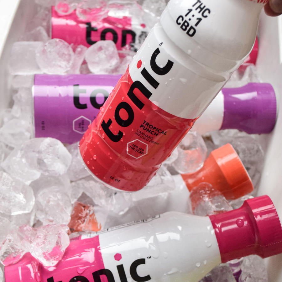 A cooler full of 12 ounce Tonic beverages of different flavors.